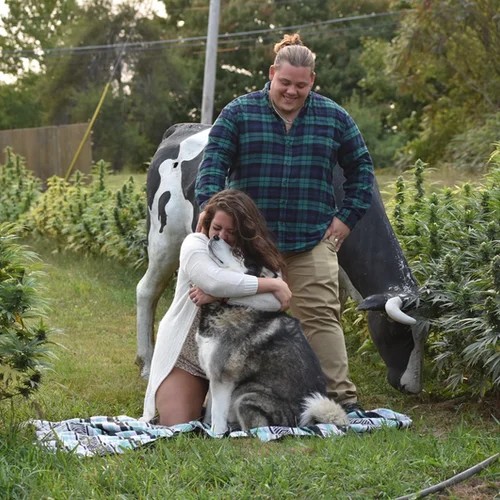 Gian and Bryanna at the farm with their dogs